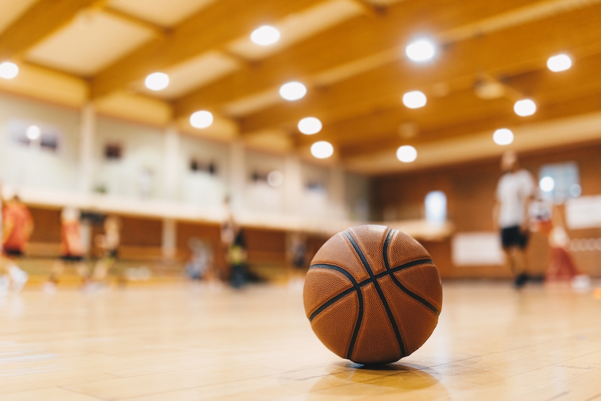 Basketball resting on a court floor